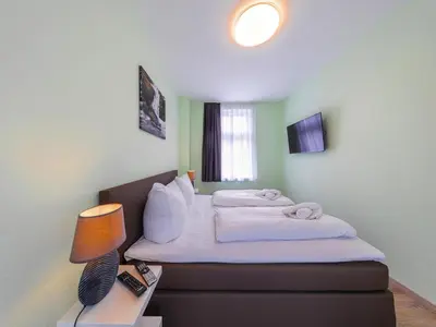 Ein Bett oder Betten in einem Zimmer der Unterkunft Ferienwohnung Remise, Wernigerode