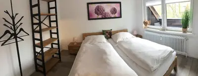 Ein Bett oder Betten in einem Zimmer der Unterkunft Ferienwohnung Eichhörnchenkobel
