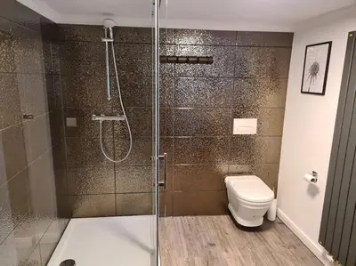 Ein Badezimmer in der Unterkunft Gruppenhaus mit Grillkota für 16 Personen in Hahnenklee