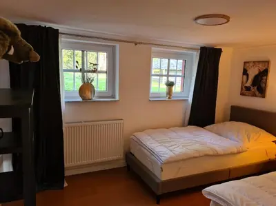 Ein Bett oder Betten in einem Zimmer der Unterkunft Gruppenhaus mit Grillkota für 16 Personen in Hahnenklee
