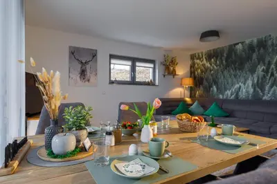Ein Sitzbereich in der Unterkunft Lindenberg Apartments