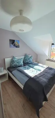 Ein Bett oder Betten in einem Zimmer der Unterkunft Ferienwohnung Teufelsmauer