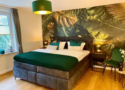 Ein Bett oder Betten in einem Zimmer der Unterkunft Traumhaus Wernigerode mit Sauna und Kamin