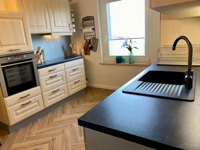 Küche/Küchenzeile in der Unterkunft Traumhaus Wernigerode mit Sauna und Kamin