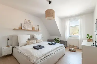 Ein Bett oder Betten in einem Zimmer der Unterkunft Premium Apartment - Ausblick - Kamin - Balkon - Smart TV - Kaffeevollautomat