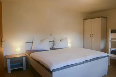 Ein Bett oder Betten in einem Zimmer der Unterkunft Ferienhaus Bomeier