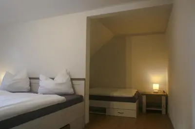 Ein Bett oder Betten in einem Zimmer der Unterkunft Ferienhaus Bomeier