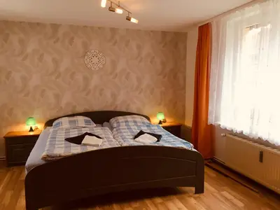 Ein Bett oder Betten in einem Zimmer der Unterkunft Ferienhaus am Fluss mit traumhafter Dachterrasse ,Garten und Grill
