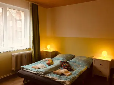 Ein Bett oder Betten in einem Zimmer der Unterkunft Haus am Fluss mit wunderschöner Dachterrasse mit Flussblick ,Garten und Grill