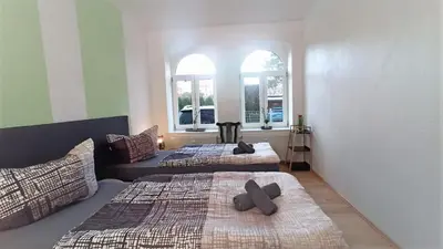 Ein Bett oder Betten in einem Zimmer der Unterkunft Apartment für bis zu 6 Personen mit Balkon