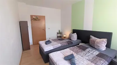 Ein Bett oder Betten in einem Zimmer der Unterkunft Apartment für bis zu 6 Personen mit Balkon