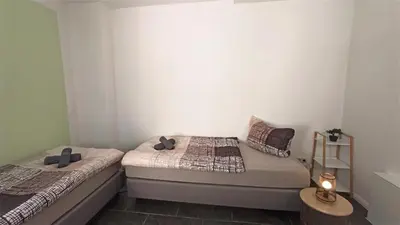 Ein Bett oder Betten in einem Zimmer der Unterkunft Apartment für bis zu 6 Personen mit Balkon