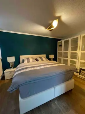Ein Bett oder Betten in einem Zimmer der Unterkunft Ferienwohnung am Burgberg in Bad Harzburg