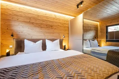 Ein Bett oder Betten in einem Zimmer der Unterkunft Bergwaldchalet Tierfreund