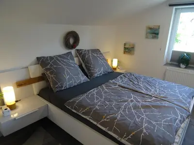 Ein Bett oder Betten in einem Zimmer der Unterkunft Sammy's FeWo