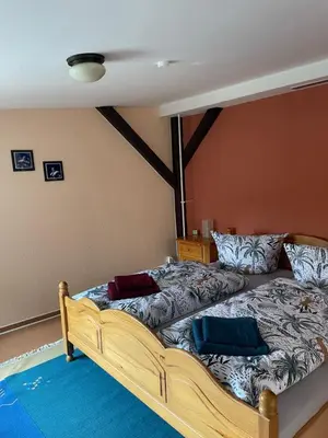 Ein Bett oder Betten in einem Zimmer der Unterkunft Zur zornigen Ameise