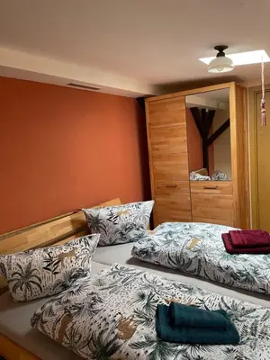 Ein Bett oder Betten in einem Zimmer der Unterkunft Zur zornigen Ameise
