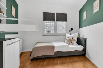 Ein Bett oder Betten in einem Zimmer der Unterkunft STANMA Hirschtraum für 7 Personen mit 3 Schlafzimmern